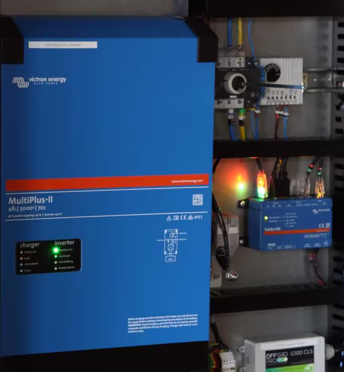 Close-up of Victron MultiPlus II inverter and monitoring equipment inside a battery energy storage system.
